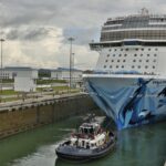 Cruise ship navigating through a ship lock.